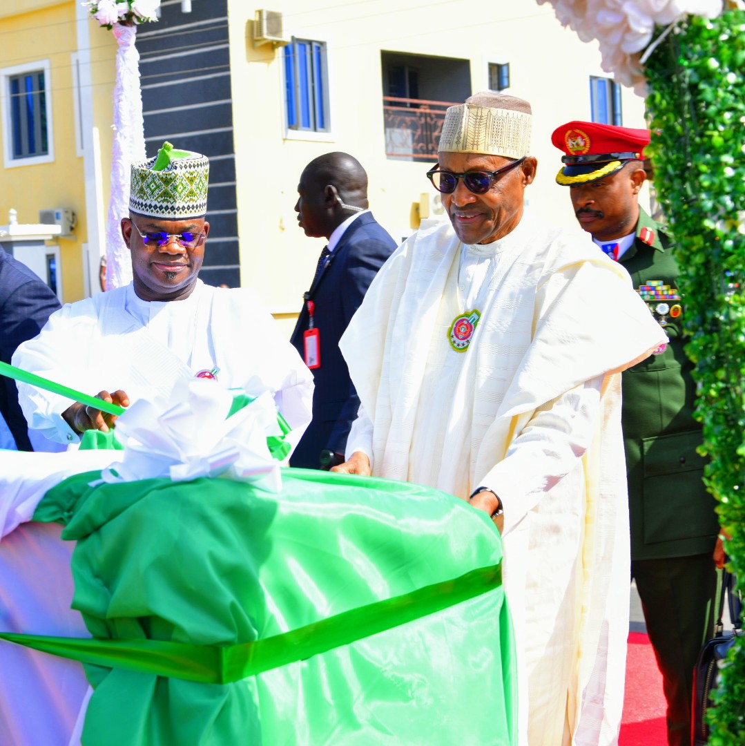 Buhari at the Commissioning of the Ohinoyi Palace, Okene, assisted by Bello